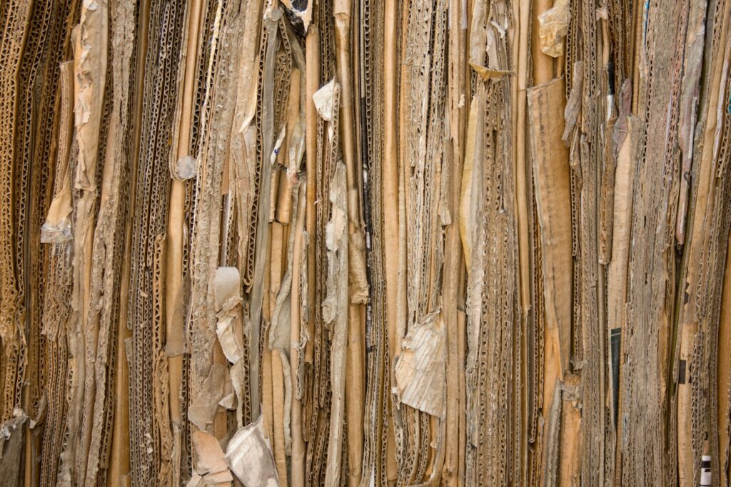 Detailed view of stacked recyclable cardboard showing texture and patterns.